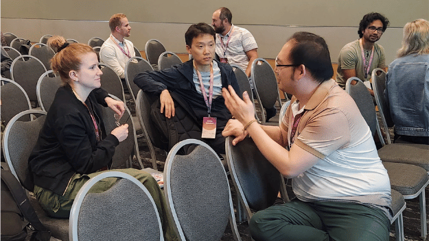 Light purple image with a bunch from different backgrounds of stick figure people in a slightly darker color. The text on the image at the top says Community Partnerships