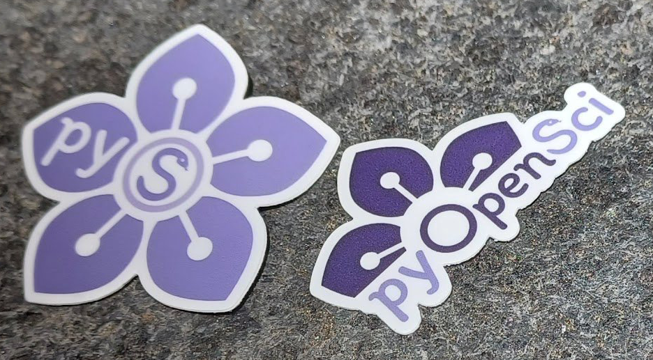 Two pyOpenSci sticker designs. the one is a light purple flower with white stamen and the letters pr and O as the center of the sticker. The S is a snake. The econd sticker is a darker and lighter purpler that says pyOPenSci and has the top half of a flower above the O in open.